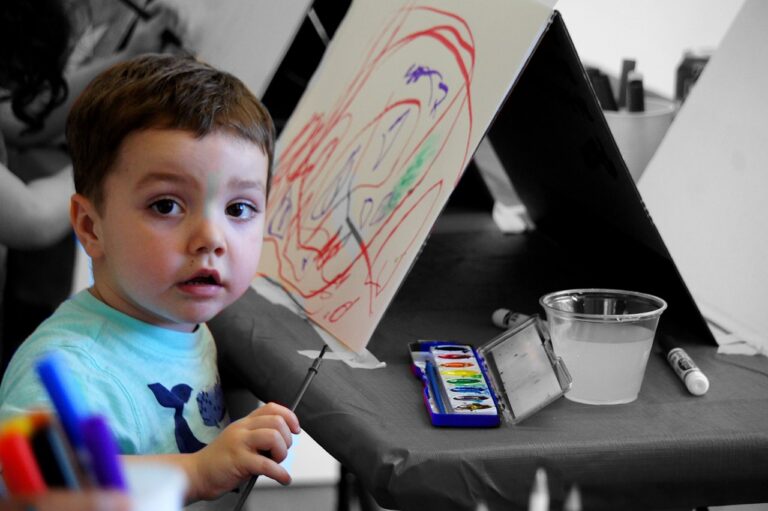 a child doing some artwork at a kindergarten Sunshine Coast parents trust